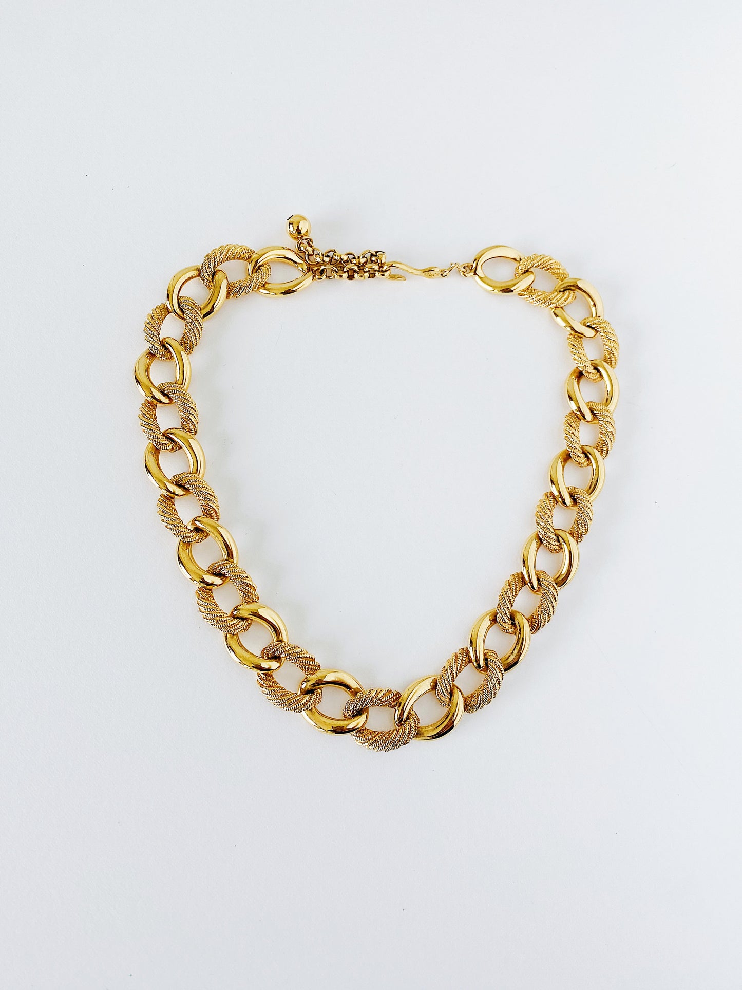 Vintage Napier gold love knot chain necklace, adjustable fish hook clasp, 1980s 1990s era, mid-weight statement necklace