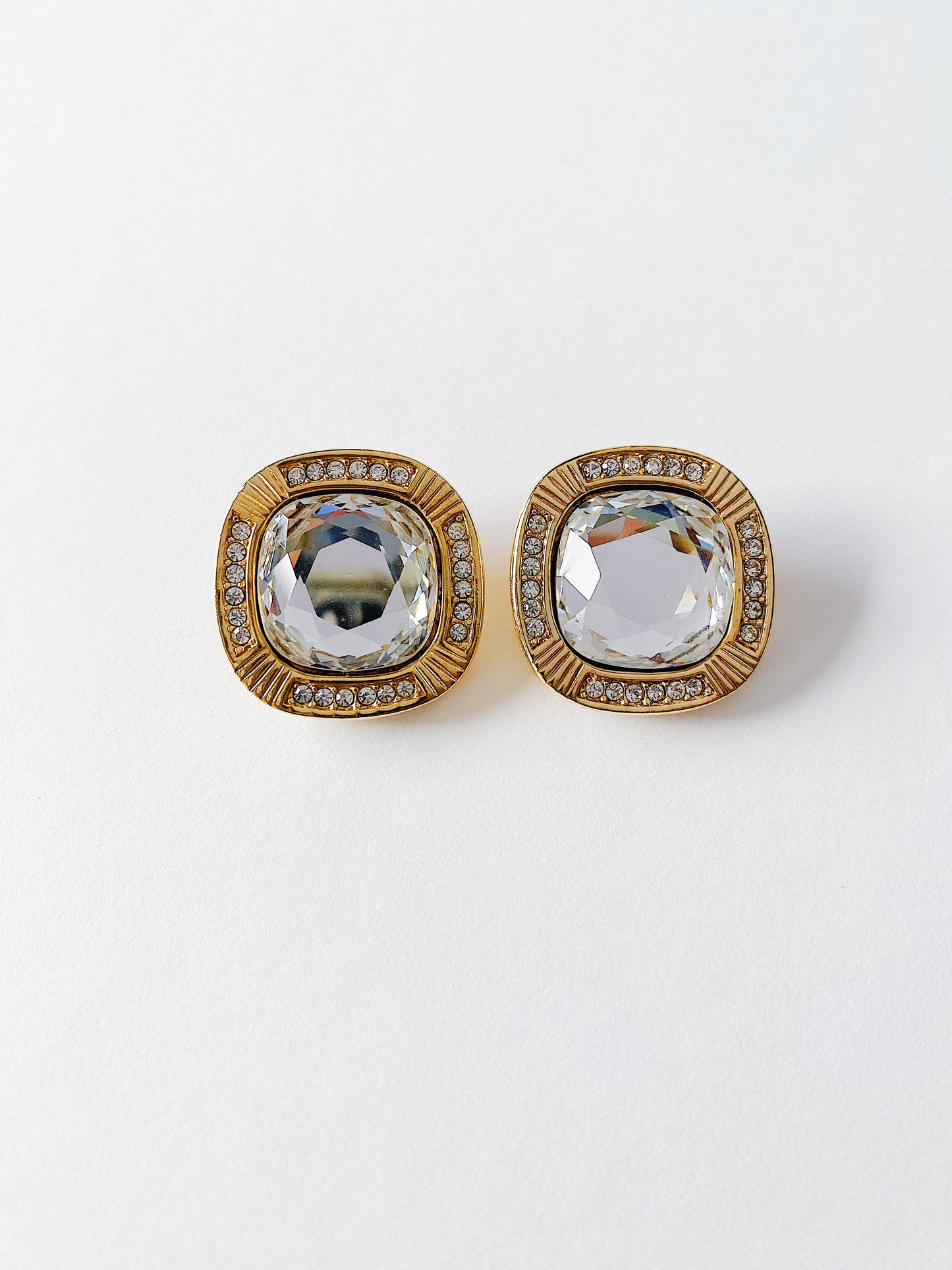 Vintage Swarovski S.A.L clear cushion-cut crystal clip-on earrings with clear crystal surround, gold plated, 1980s collectible jewelry.