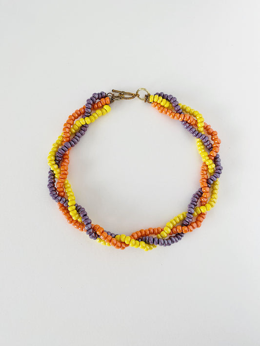 Vintage 1950s braided glass bead necklace in orange, yellow, and purple, mid-century multicolor statement necklace