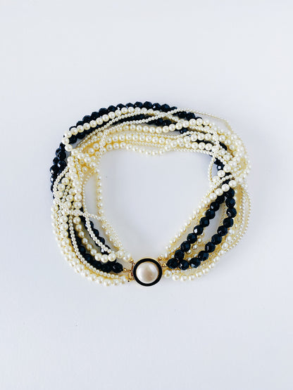 Vintage 1980s Carolee 10-strand faux pearl necklace, black bead accents, gold-plated enamel clasp, 17 inches, heavy weight statement jewelry