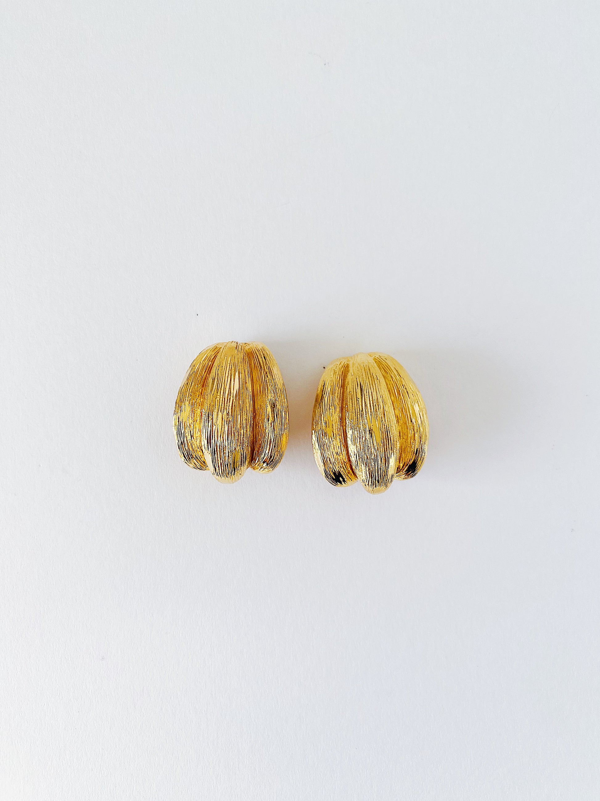 Vintage 1980s St. John sculptural shell earrings, 24K gold-plated clip-ons, bold textured statement earrings, classic coastal design.