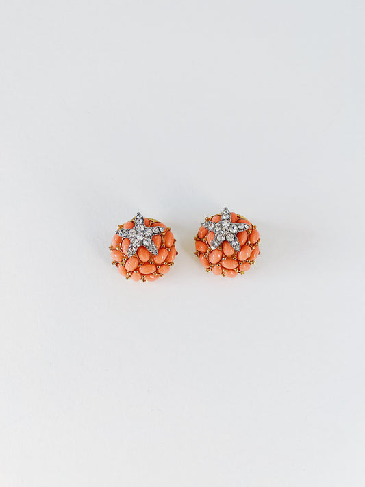 Vintage 1990s KJL Kenneth Jay Lane starfish earrings, faux coral cluster with clear rhinestone pave, gold-tone clip-on statement earrings.