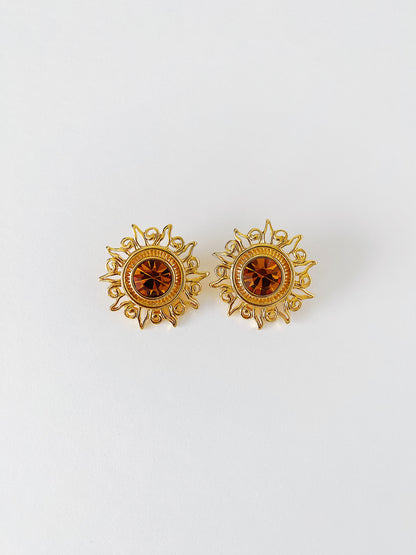 Vintage 1990s KJL Kenneth Jay Lane sunburst clip-on earrings with amber rhinestones