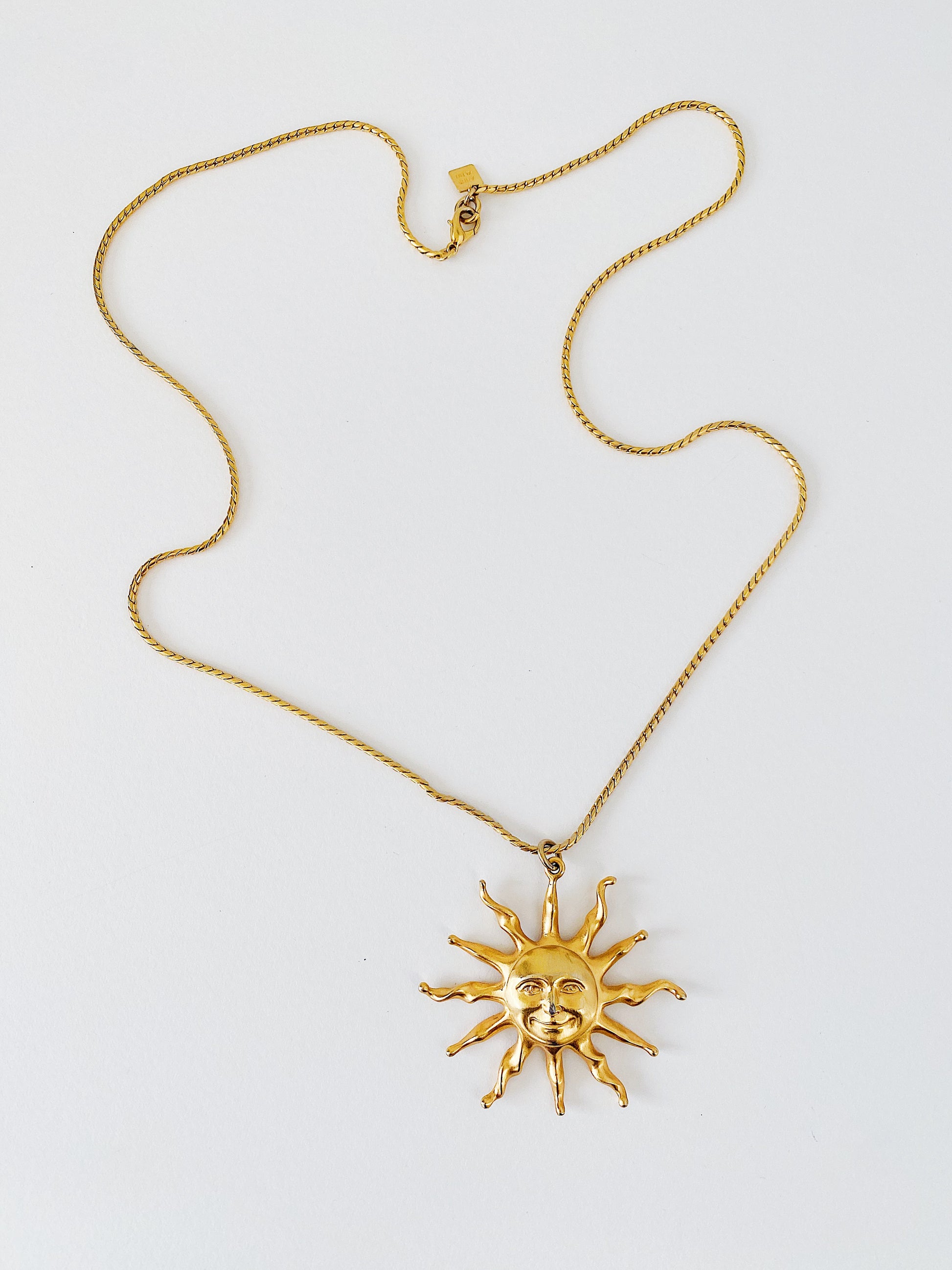 Vintage Anne Klein celestial sun pendant necklace, 31 inch foxtail chain, signed pendant with lion logo hangtag, gold-tone statement necklace.