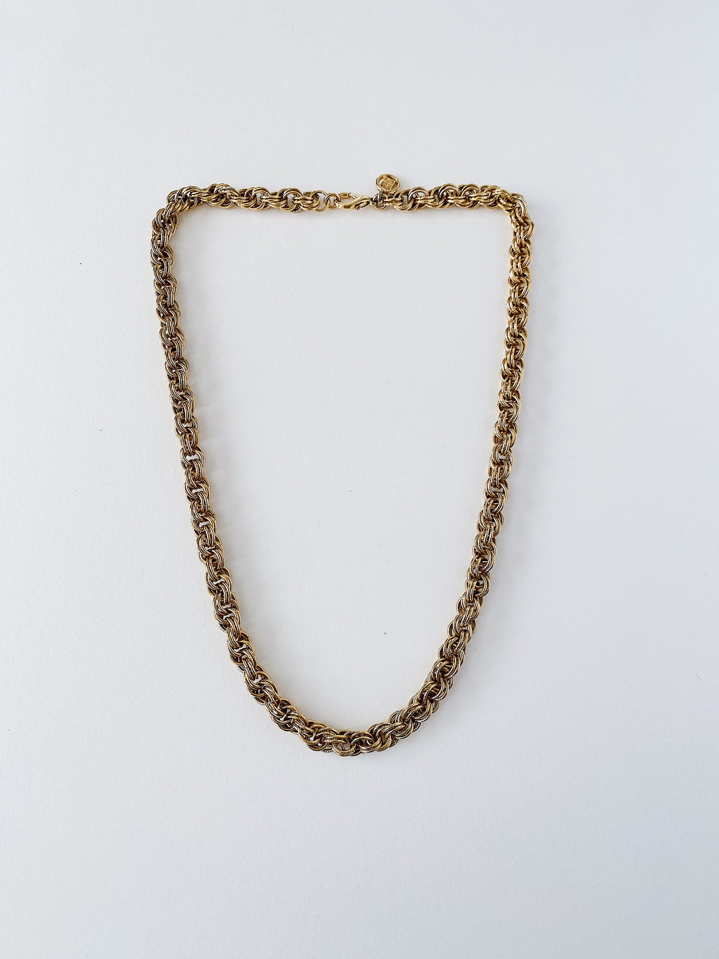 Vintage Givenchy double link chunky chain necklace with GG logo hang tag, gold-plated designer jewelry from the 1980s–1990s.