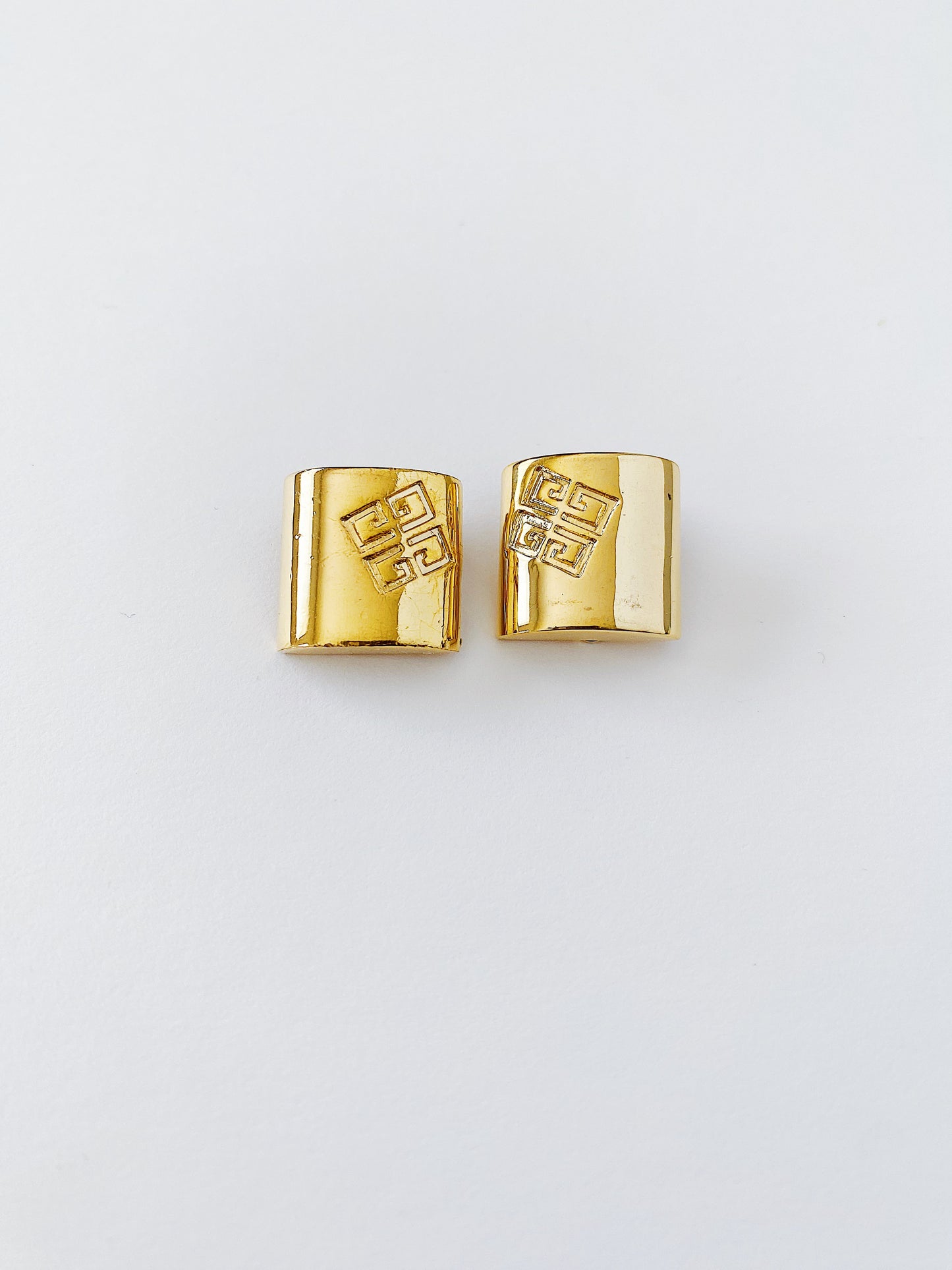 Vintage Givenchy gold logo earrings, 1980s square clip-on studs, small designer earrings with embossed logo"