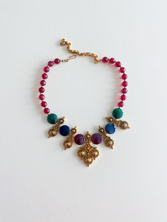 Vintage José & Maria Barrera for Avon Adriatic bib necklace, 1991, featuring royal blue iridescent glass beads, Etruscan-style gold-tone plates, and original Avon box.