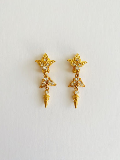 Vintage 1980s brushed gold spike dangle clip-on earrings with clear rhinestone accents, bold statement jewelry.