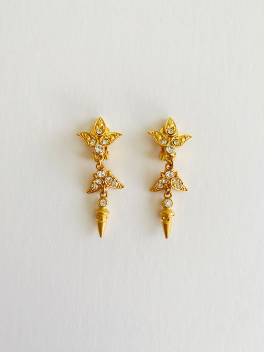 Vintage 1980s brushed gold spike dangle clip-on earrings with clear rhinestone accents, bold statement jewelry.