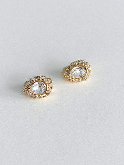 Vintage 1990s Swarovski teardrop crystal clip-on earrings with round crystal halo in tone-plated metal setting.